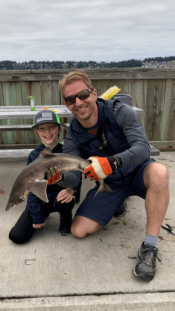 after-the-rain.org / Father and son with shark